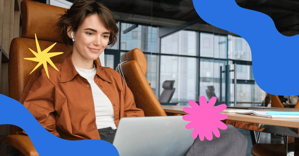 A woman in a brown shirt working on laptop